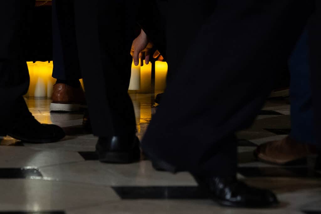 Members of Congress place candles below a photo of Charlie Kirk and his family at the conclusion of a vigil for him in Statuary Hall at the Capitol, in Washington, D.C., U.S., on September 15, 2025. (Photo by Allison Bailey/NurPhoto via AP)