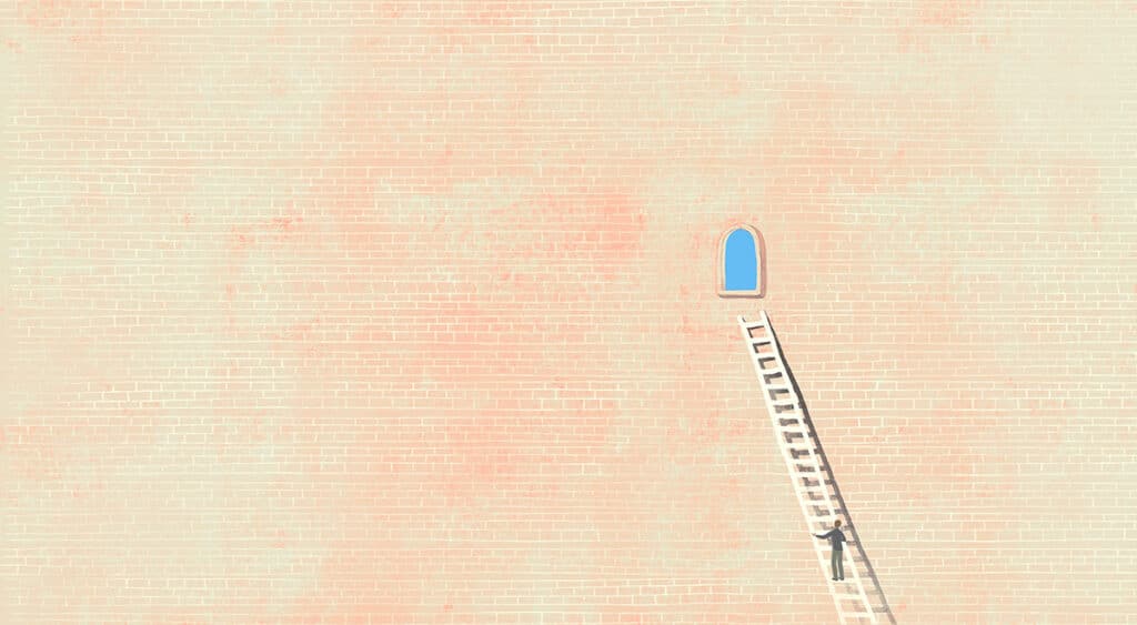 A person climbing up a ladder against a brick wall toward a window to the sky