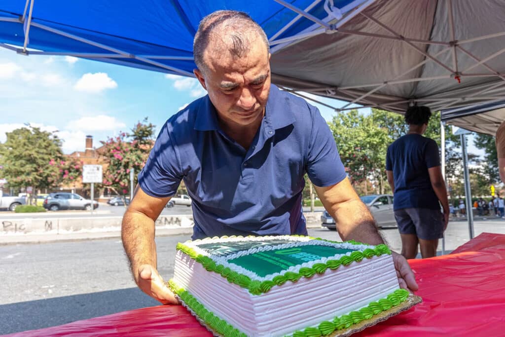 A baker delivers a free birthday cake to a homeless person