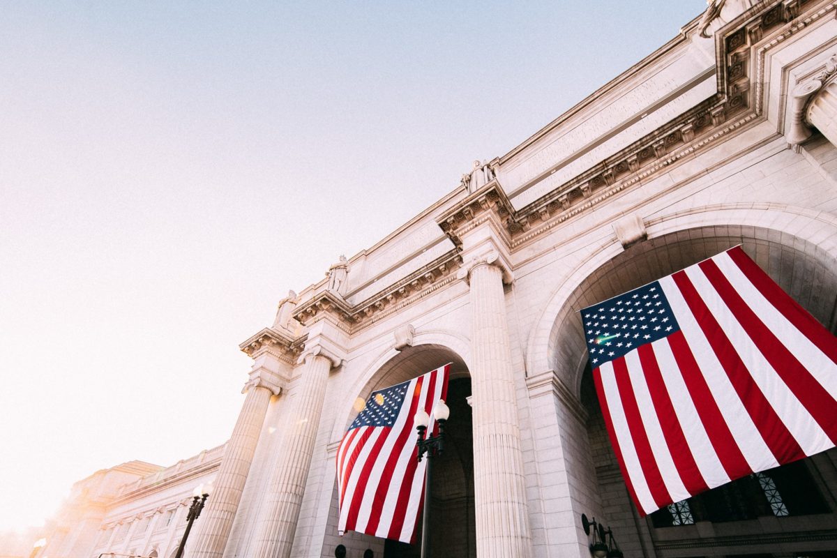 a large building with two american flags