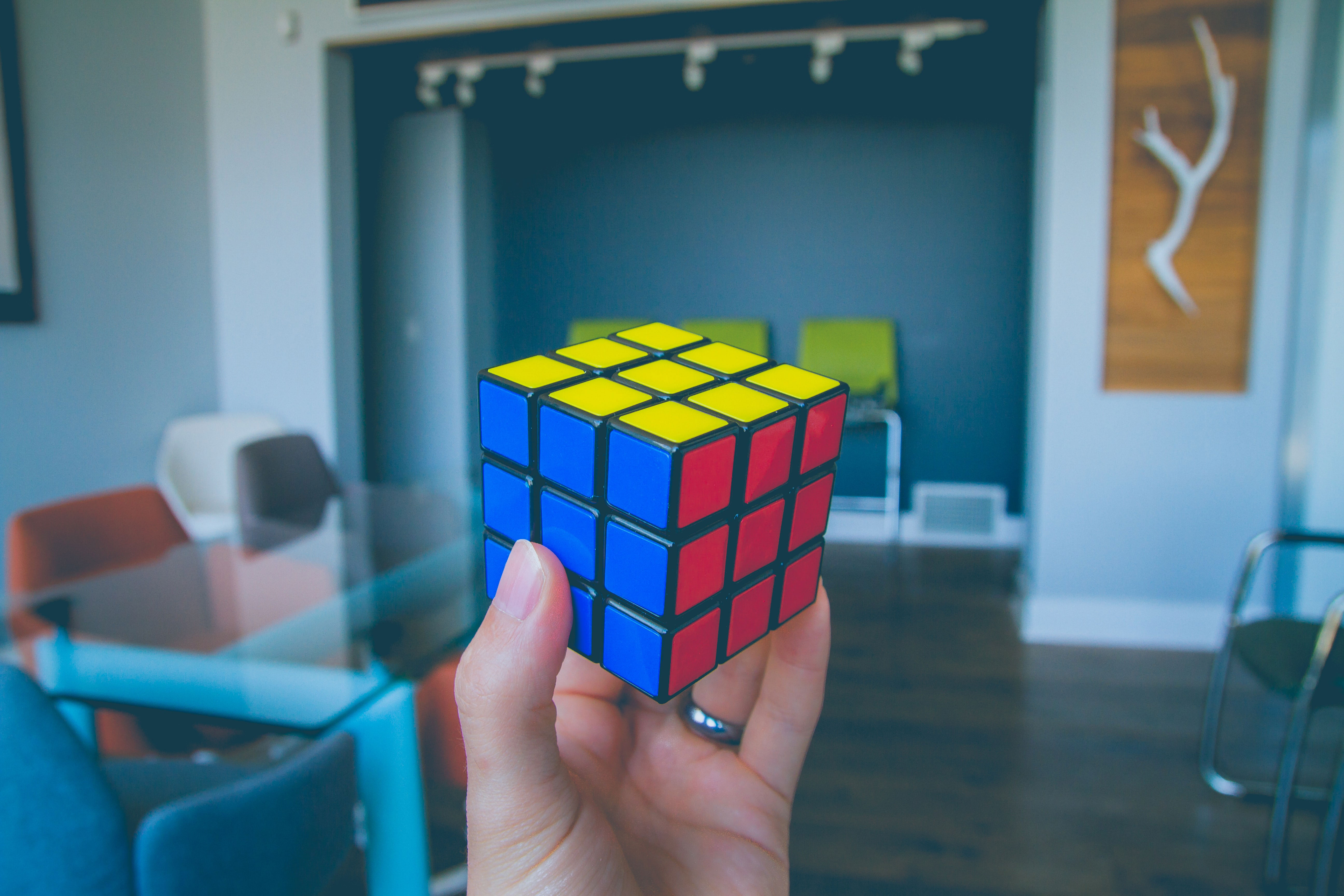 Hands solving Rubik's Cube