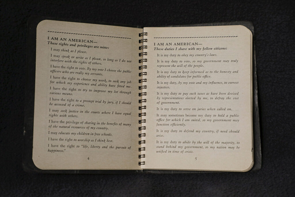 A photo of a 1954 booklet listing the basic rights, privileges, and duties of all Americans
