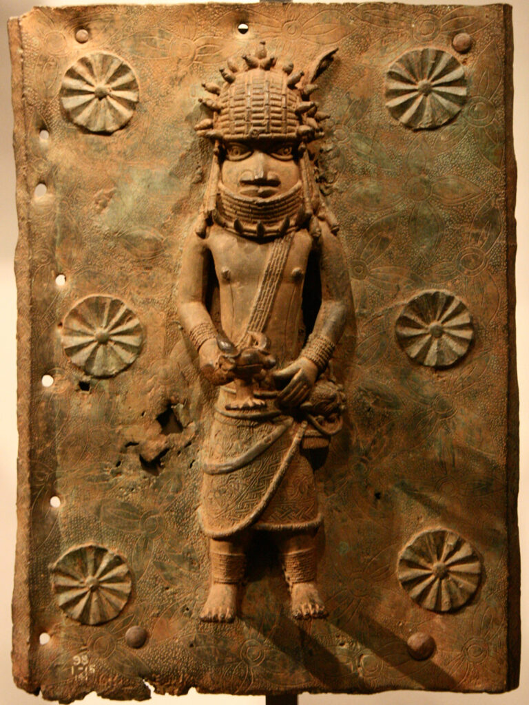 Photo of a Benin bronze plaque on display at a museum