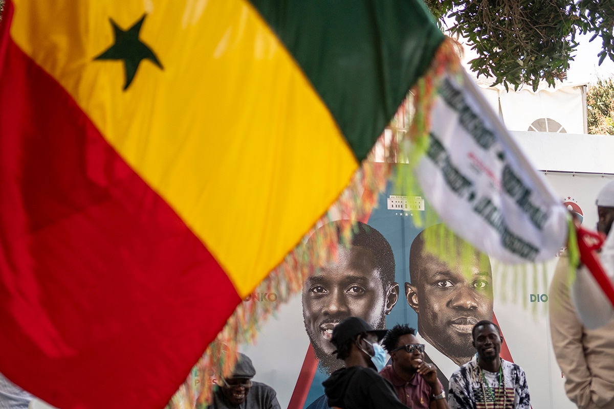 Supporters of Presidential candidate Bassirou Diomaye Faye gather at his campaign headquarters after preliminary results put him as the expected winner, in Dakar, Senegal, Monday, March 25, 2024. Faye's expected victory reflected frustration among youth with high unemployment and concerns about governance in the West African nation. Faye, backed by popular opposition leader Ousmane Sonko, has vowed to protect Senegal from corruption and interference from foreign powers like former colonial master France. (AP Photo/Mosa'ab Elshamy)