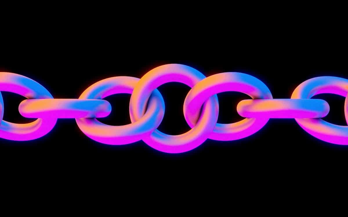 A brightly colored chain against a black background