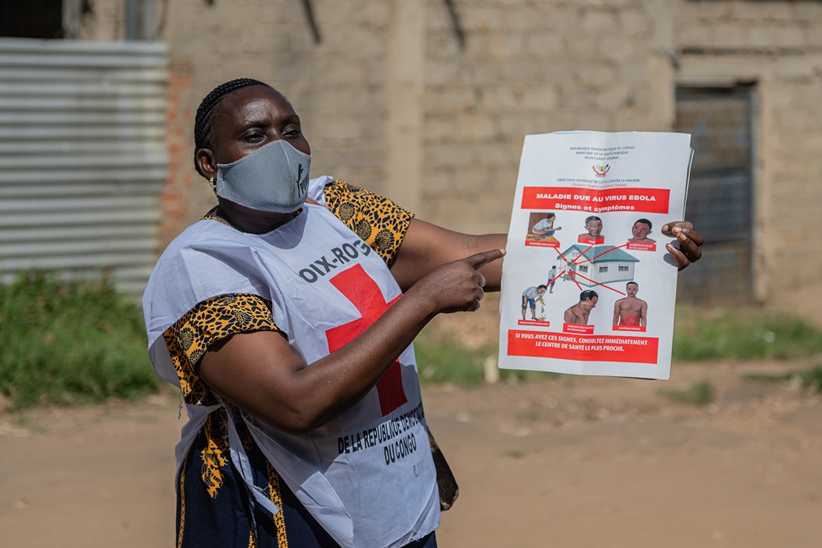 Vanny Birungi, a Red Cross volunteer, on a house-to-house sensitisation campaign amid the Ebola outbreak in Bunia, Congo, Monday, May 25, 2026. (AP Photo/Moses Sawasawa)
